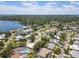 Overhead shot captures a scenic residential area surrounded by lush trees and a tranquil body of water at 2502 Tropical Shores Se Dr, St Petersburg, FL 33705