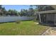 Fenced backyard with a screened in porch at 2502 Tropical Shores Se Dr, St Petersburg, FL 33705