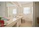Simple bathroom features an extended vanity, mirror and medicine cabinet at 2502 Tropical Shores Se Dr, St Petersburg, FL 33705