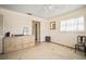 This unfurnished bedroom offers a window, closet, and mirror at 2502 Tropical Shores Se Dr, St Petersburg, FL 33705