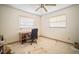 This empty bedroom contains two windows and a ceiling fan at 2502 Tropical Shores Se Dr, St Petersburg, FL 33705