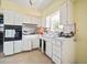 Traditional kitchen with potential for upgrades, featuring a window over the sink at 2502 Tropical Shores Se Dr, St Petersburg, FL 33705