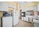 Bright kitchen featuring classic appliances and white cabinets at 2502 Tropical Shores Se Dr, St Petersburg, FL 33705