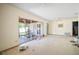Spacious living room featuring sliding glass doors to the lanai and a ceiling fan at 2502 Tropical Shores Se Dr, St Petersburg, FL 33705