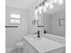 Stylish bathroom featuring a modern vanity, quartz countertop, and brushed black fixtures at 2701 Camellia Ter, Punta Gorda, FL 33950