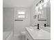 Modern bathroom with a new vanity, quartz countertop, and brushed black fixtures at 2701 Camellia Ter, Punta Gorda, FL 33950