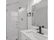Bathroom featuring a glass shower, vanity with sink and faucet, and a mirror at 2701 Camellia Ter, Punta Gorda, FL 33950