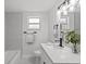 Stylish bathroom featuring a modern vanity, quartz countertop, and brushed black fixtures at 2701 Camellia Ter, Punta Gorda, FL 33950
