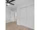 A bedroom with a ceiling fan and a large sliding door at 2701 Camellia Ter, Punta Gorda, FL 33950