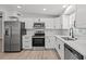Bright modern kitchen featuring stainless steel appliances, white cabinets, and subway tile backsplash at 2701 Camellia Ter, Punta Gorda, FL 33950