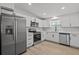 Modern kitchen featuring stainless steel appliances, ample counter space, and white cabinetry at 2701 Camellia Ter, Punta Gorda, FL 33950