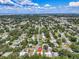 Wide aerial shot showcases the property's location in a well-established neighborhood with easy access to nearby amenities at 296 Huntington Dr, Largo, FL 33771