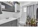 Bathroom with a gray vanity, a white tiled wall, and a bathtub with a shower at 296 Huntington Dr, Largo, FL 33771
