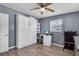 Bedroom with a murphy bed, laminate floors, and gray colored walls at 296 Huntington Dr, Largo, FL 33771