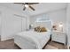 Bedroom with white walls, a ceiling fan, and a closet with sliding doors at 296 Huntington Dr, Largo, FL 33771