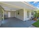 Covered carport featuring direct access to the home and additional storage space at 296 Huntington Dr, Largo, FL 33771