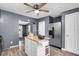 Galley kitchen featuring butcher block island, stainless appliances, and hardwood flooring at 296 Huntington Dr, Largo, FL 33771