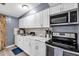 This kitchen features marble countertops, stainless steel appliances, and a subway tile backsplash at 296 Huntington Dr, Largo, FL 33771