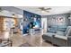Open-concept living room showcasing stylish decor, wood floors, and seamless flow to kitchen at 296 Huntington Dr, Largo, FL 33771