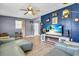 Stylish living room featuring accent wall, modern furniture, and bright, open space at 296 Huntington Dr, Largo, FL 33771