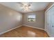 Bedroom featuring wood floors, neutral walls, a window and closet at 3009 Ainsworth Ave, Spring Hill, FL 34609
