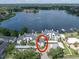 Stunning aerial view of lakefront townhomes featuring lush landscaping and boat docks at 3127 W Sligh Ave # 101C, Tampa, FL 33614