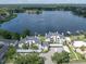 Aerial view showcasing lakeside condos with water access and beautiful surrounding landscape at 3127 W Sligh Ave # 101C, Tampa, FL 33614