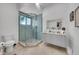 Bathroom with blue-accented tile and a glass shower at 3127 W Sligh Ave # 101C, Tampa, FL 33614