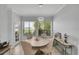 Inviting dining area with a charming chandelier and natural light streaming through the windows at 3127 W Sligh Ave # 101C, Tampa, FL 33614