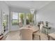 Charming dining room featuring a chandelier and serene views of the lake at 3127 W Sligh Ave # 101C, Tampa, FL 33614