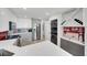 Modern kitchen with sleek cabinetry, stainless steel appliances, and built in washer/dryer at 3127 W Sligh Ave # 101C, Tampa, FL 33614
