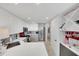 Contemporary kitchen with white cabinets, stainless steel appliances, and ample counter space at 3127 W Sligh Ave # 101C, Tampa, FL 33614