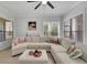 Bright living room with a neutral sectional sofa and view to the exterior at 3127 W Sligh Ave # 101C, Tampa, FL 33614
