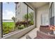 Enjoy the outdoors from this relaxing screened patio with stunning views of the lake and lush landscaping at 3127 W Sligh Ave # 101C, Tampa, FL 33614