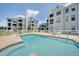 Enjoy this community pool and pristine landscaping, all surrounded by white fencing at 3127 W Sligh Ave # 101C, Tampa, FL 33614