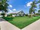 Well-maintained back exterior with lush lawn and mature trees offering a peaceful and private setting at 3503 Graycliff Ln, Brandon, FL 33511