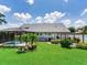 A great backyard offers an enclosed pool, landscaping, and a spacious lawn at 3503 Graycliff Ln, Brandon, FL 33511
