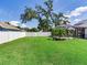 The property features a spacious backyard with a screened pool and green lawn at 3503 Graycliff Ln, Brandon, FL 33511