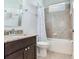 Updated bathroom with granite countertops, tiled shower, modern fixtures, and bathtub at 3503 Graycliff Ln, Brandon, FL 33511