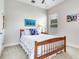 Bright bedroom featuring a cozy bed, carpet, a large window, and stylish decor at 3503 Graycliff Ln, Brandon, FL 33511