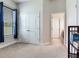 Bedroom featuring a window, closet, carpet, and view of the ensuite bathroom at 3503 Graycliff Ln, Brandon, FL 33511