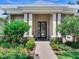 Close-up of front entry highlighting front door, manicured landscaping and stone accents at 3503 Graycliff Ln, Brandon, FL 33511