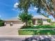 Charming single-story home featuring a three-car garage, manicured lawn, and inviting front entrance at 3503 Graycliff Ln, Brandon, FL 33511