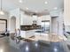 Well-lit kitchen featuring white cabinets, black countertops, and stainless steel appliances at 3503 Graycliff Ln, Brandon, FL 33511