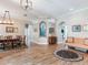 Open-concept living area featuring wood-look floors, designer accents, and a dining area at 3503 Graycliff Ln, Brandon, FL 33511