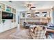 Bright living room features built-in shelving and a comfortable couch with a ceiling fan above at 3503 Graycliff Ln, Brandon, FL 33511