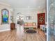 Elegant living room boasts wood floors, decorative wall art, and stylish furnishings at 3503 Graycliff Ln, Brandon, FL 33511