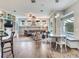 Open living area featuring built-in shelving, a ceiling fan, and views of the pool at 3503 Graycliff Ln, Brandon, FL 33511