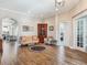 Cozy living room showing wood floors, a hutch, and an open floor plan at 3503 Graycliff Ln, Brandon, FL 33511