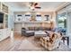 Comfortable living room with a sectional sofa, ceiling fan, and view of the backyard at 3503 Graycliff Ln, Brandon, FL 33511
